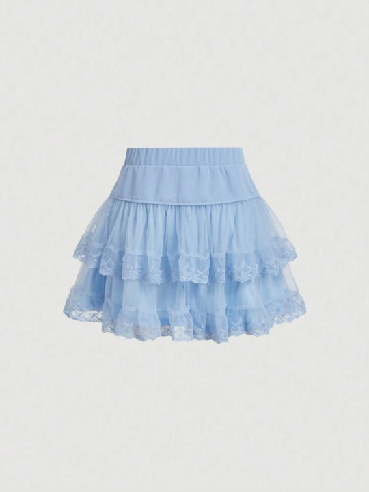 Falda unicolor con malla y lazos