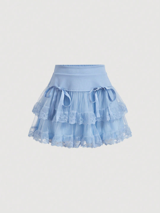 Falda unicolor con malla y lazos