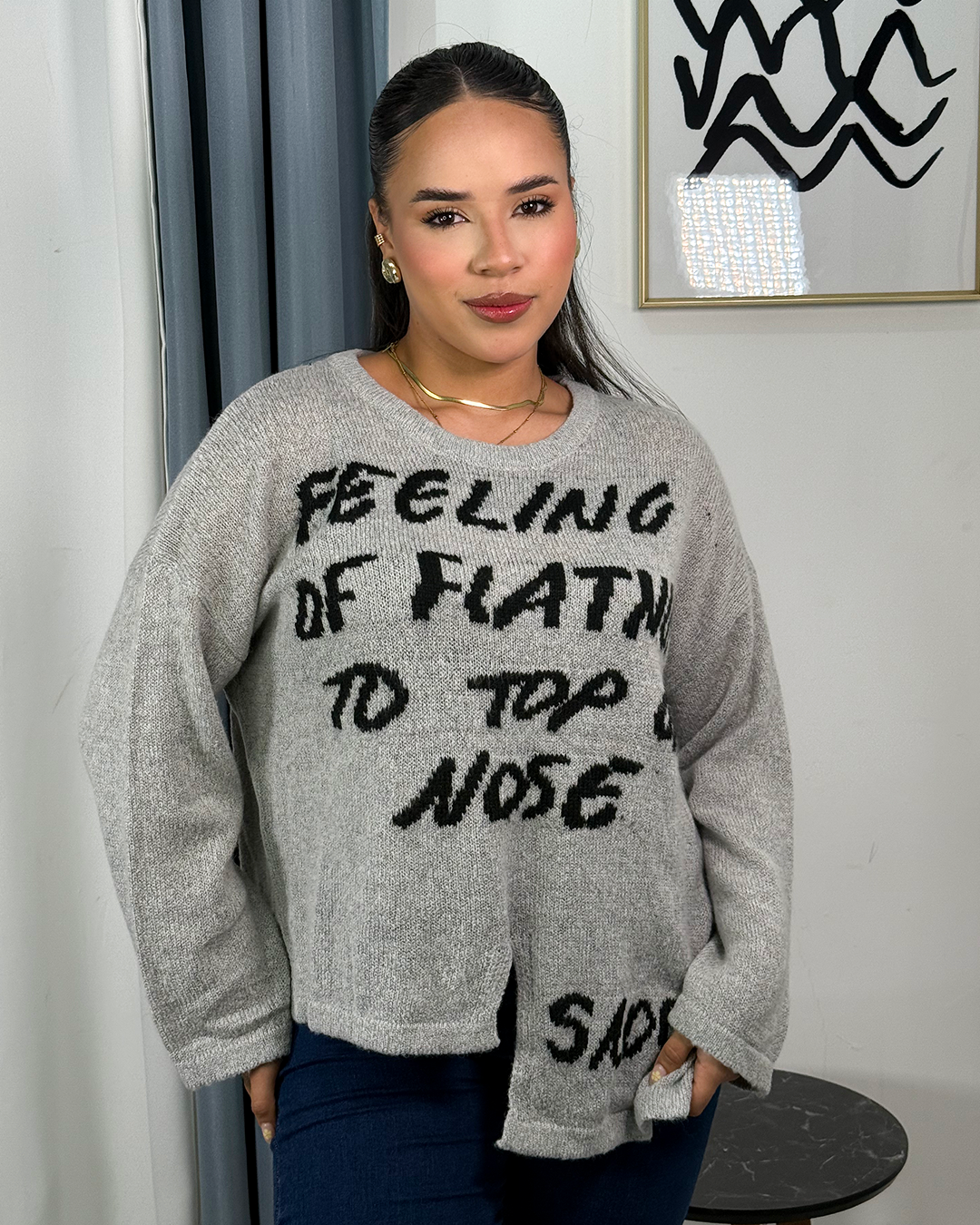 Sueter jersey tejido con diseño rasgado