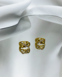 Aretes con diseño de infinito con detalles brillantes enchapado en oro 18k acero inoxidable