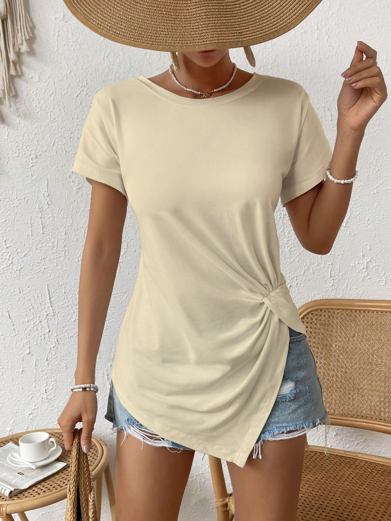 Blusa manga corta con nudo en el dobladillo