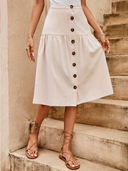 Falda media larga unicolor con botones delantero