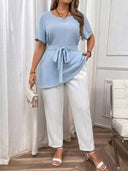 Blusa unicolor elegante con cinturon
