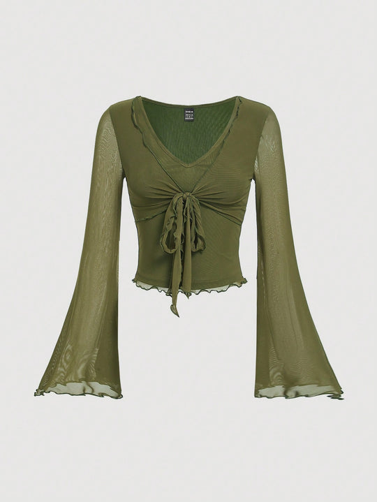 Sueter manga larga con detalle de nudo en el frente