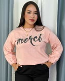 Sueter holgado con letras y manga bombacha