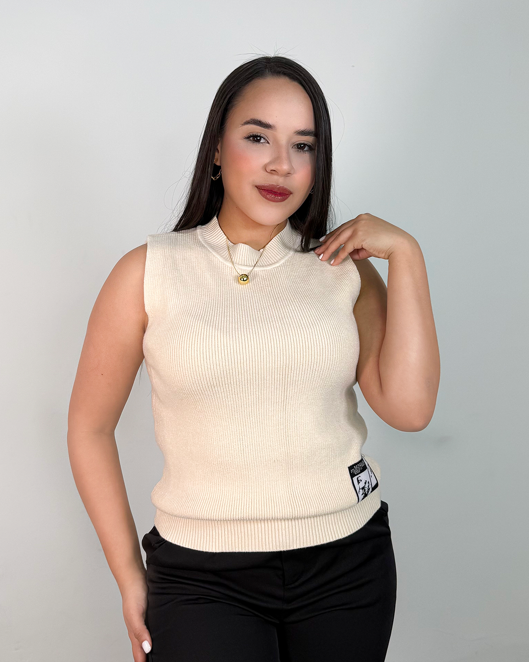 Sueter tejido unicolor sin mangas