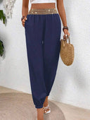 Pantalon unicolor con detalle dorado