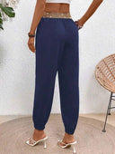 Pantalon unicolor con detalle dorado