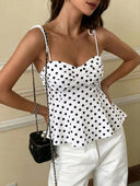 Blusa de lunares sin manga con dobladillo con volantes