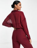 Blusa manga larga transparente unicolor