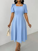 Vestido elegante con manga bombacha y cuello cuadrado