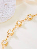 Cinturon de metal conn perlas y diseño floral