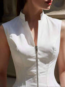 Blusa sin manga elegante cuello alto, con cremallera y acampanado bajo